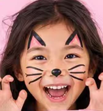 A girl making cat claws, with black cat ears, nose and whiskers face-painted